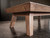 Angled shot of the Nixon Desyn Pool Table in Gray Walnut focusing on the sculptural Parsons-style legs. This image captures the slightly tapered, outward-kicking legs and smooth transitions between the apron and leg joints, emphasizing the table’s clean, mid-century modern craftsmanship.