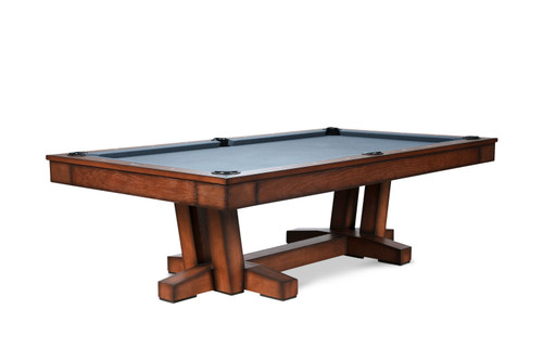 Elegant transitional contemporary pool table, the Doc & Holliday Caroline Slate Pool Table, showcasing its sleek frame and classic design. The image highlights the table's sophisticated wood finish and premium felt, set against a tastefully decorated game room that exemplifies luxury and style.