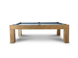 Side view of the Paula Parsons Slate Pool Table in Glazed Maple finish by Doc & Holliday, showcasing its smooth maple wood craftsmanship, elegant dining functionality, and genuine leather drop pockets, all set against a clean white background.