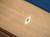 Detailed view of the Paula Parsons Slate Pool Table’s mother of pearl billiard sites, offering a sophisticated touch that complements its luxurious design and premium craftsmanship.