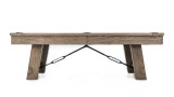 The Isaac Slate Pool Table captured from the side, highlighting the tapered, outward-flaring legs and brushed black steel turnbuckles that give this table its industrial elegance and strength.