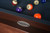 Crafted with leather pockets, a stainless steel 'Made in the USA' logo, and fine billiard felt, the Jackie's Pool Table in Pecan Bourbon Walnut is fully customizable and available exclusively at Sawyer Twain.