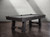 A dynamic 3/4 angle view of the Isaac Slate Pool Table in Distressed Black & Gold, placed in a stylish lifestyle environment. The table’s rugged finish, gold turnbuckles, and professional-grade features are highlighted, demonstrating its versatility in any high-end setting, whether at home or in a commercial space.