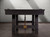 The Isaac Slate Pool Table in Distressed Black & Gold, shown without the optional dining top. This view emphasizes the game table setup, with the premium 1” 3-piece slate surface and professional-grade cushions. The combination of Distressed Black wood and gold accents creates a sophisticated and modern look for your entertainment space.