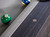 A close-up view of the billiard sights on the Isaac Slate Pool Table in Distressed Black & Gold, highlighting their detailed craftsmanship. The sights are aligned perfectly, providing both an aesthetic detail and functionality for precise gameplay.
