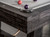 Detailed close-up shot of the finger-jointed rails on the Isaac Slate Pool Table, showcasing the craftsmanship in the Distressed Black finish. The finger joints are designed for optimal durability, ensuring long-lasting stability and professional-level play.