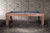 This side lifestyle shot highlights the clean, architectural lines of the Alta Slate Pool Table in its exclusive Honey Ash finish. The Parsons-style legs and solid ash wood frame are bathed in natural light, while the dining top sits seamlessly in place. Designed by American Heritage Billiards and available only at Sawyer Twain, this image captures how effortlessly the Alta blends into modern dining and entertaining spaces.