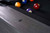 This zoomed-in image highlights the precision-cut diamond sights embedded in the rail, each shimmering subtly against the customizable felt and ash wood frame. The placement is symmetrical and functional, built for serious play with a stylish, minimalist look.