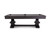 A full profile view that highlights the linear grain of the pine wood and the architectural presence of the table’s solid structure.