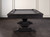Presents the table from the side, styled in a finished game room environment to show scale, contrast, and real-world impact.