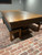 This view showcases the Beaumont with its matching dining top and accompanying benches, turning the pool table into an elegant dining solution. The Distressed Brown finish, paired with sleek modern benches, seamlessly transforms the piece into both a functional and stylish statement for the home. The spacious room emphasizes how the table works as a multifunctional, statement piece that balances leisure with luxury.