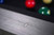 A lifestyle corner shot focused on the top rail, felt, and mother-of-pearl diamond sight markers. The rich texture of the Gray Marble finish adds depth to this refined gaming surface. Supports searches like “designer gray pool table with inlay sights,” or “luxury rail details modern billiards table.”

