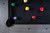 Overhead shot of the Gray Marble Vancouver with Trophy Kit pool balls racked on the slate and mother-of-pearl sights catching the light. A detail-packed photo that resonates with “premium pool tables with diamond sights,” “designer gray pool table with custom balls,” and “Sawyer Twain Trophy Kit styled setup.”