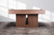 A low, wide-angle lifestyle shot of the Vancouver Slate Pool Table in Honey Ash, drawing the eye to its distinctive reeded wood legs and grounded silhouette. This architectural detail anchors the table with a modern, sculptural presence—perfect for design-savvy shoppers looking for “pool tables with decorative wood base,” “modern reeded leg game tables,” or “high-end slate pool tables with bold furniture styling.”


