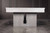 A moody lifestyle vignette captures the Vancouver’s architectural base in all its glory. The American Heritage Billiards craftsmanship is on full display, with reeded wood texture casting soft shadows across the floor—only available through SawyerTwain.com.