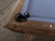 Close-up of the Nixon Desyn Slate Pool Table corner pocket in Gray Walnut, showing the genuine leather drop pocket integrated into the softly tapered rail. Highlights the smooth finish, tight joinery, and modern profile, offering a clear look at both function and luxury material detailing.