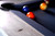 A sharp close-up along the rail reveals the black diamond-shaped sights set into the White Wash finish of the Vancouver Slate Pool Table. Their matte contrast adds visual rhythm to the clean-lined surface, while quietly reinforcing the table’s serious playability and exclusive build from American Heritage Billiards and Sawyer Twain.