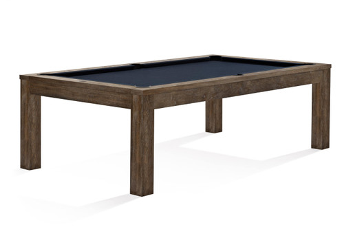 Experience the full elegance of the Brunswick Soho Slate Pool Table, perfectly staged in a luxurious game room setting. This image captures the table's sleek nutmeg finish and Parsons-style silhouette, featuring solid mahogany construction and a white oak veneer. The professional-grade, Brunswick Certified 1-inch slate visible under the luxurious felt top, provides a glimpse into the table’s exceptional playability.