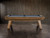 Side view of the Nixon Billiards Desyn Slate Pool Table in Gray Walnut, styled in a professionally designed game room with natural light, neutral furnishings, and wood flooring. The image showcases the full length of the table, mid-century Parsons-style legs, and warm finish — ideal for inspiring luxury interior design ideas and upscale home layouts.