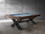 The Portland Slate Pool Table is styled in a loft-inspired room with concrete textures, black accents, and layered lighting. The industrial legs and rustic cradle tie into the room’s masculine, design-forward aesthetic, making the table the visual centerpiece.