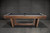 Detailed close-up showcasing the Kai Pool Table's sleek, tapered legs seamlessly merging into the central crossbeam, emphasizing its mid-century contemporary style.