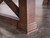 Close-up of the farmhouse-style legs on the Nora Slate Pool Table in Brown Wash. Crafted from solid wood, these legs feature a classic, sturdy design that complements the rustic farmhouse aesthetic. The table’s legs provide both support and timeless charm, making it a standout piece in any home. Available exclusively at Sawyer Twain.

